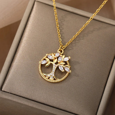 Stainless steel tree of life round pendant necklace with crystal rhinestones on a link chain for women.