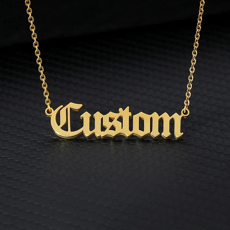 Old English custom name necklace in gold stainless steel with link chain.
