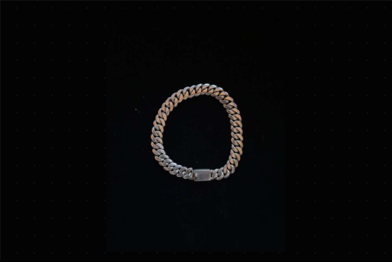 8MM Miami Cuban Link Bracelet with high-polish stainless steel links and box clasp on black background.