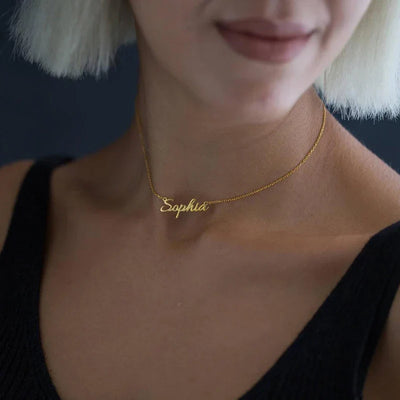 Custom crown name necklace on woman, 18K gold plated, minimalist design.